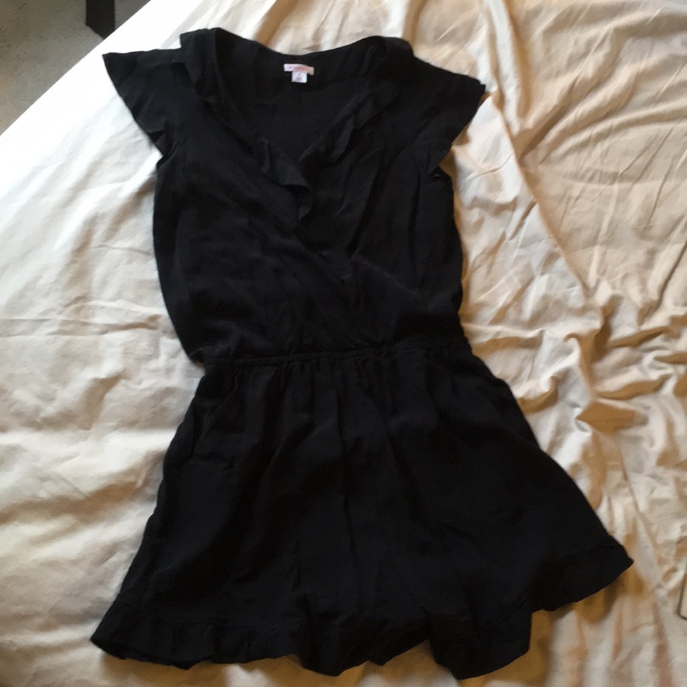 V-neck romper with ruffled neck/sleeves/cuffs